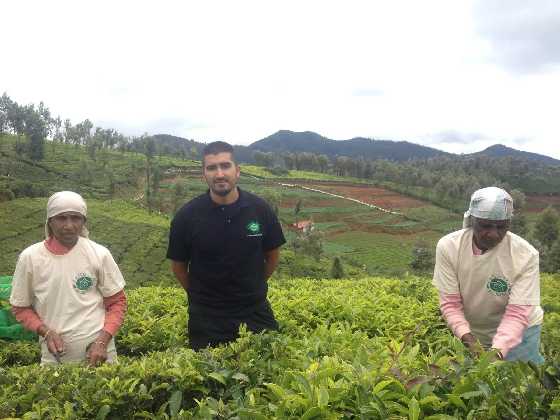 Fernando Lopez with two tea pickers in a tea garden